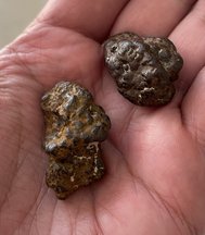 Picture of iron(III) oxide concretions found at a beach.