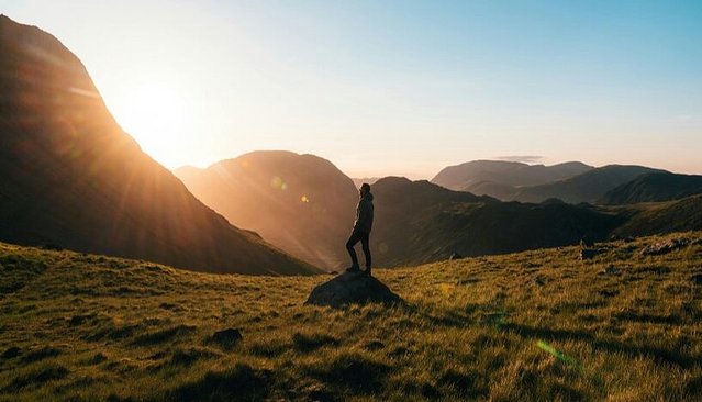 A hiker watching the sunset.